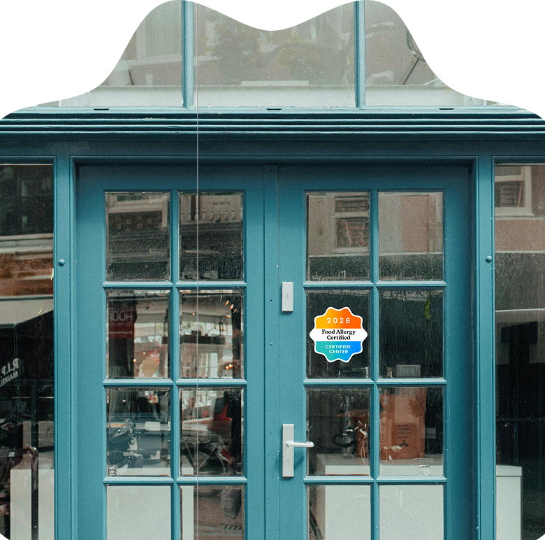 A certified center storefront displaying the Food Allergy Certified decal