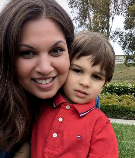 Amber, the founder, smiling with her young son